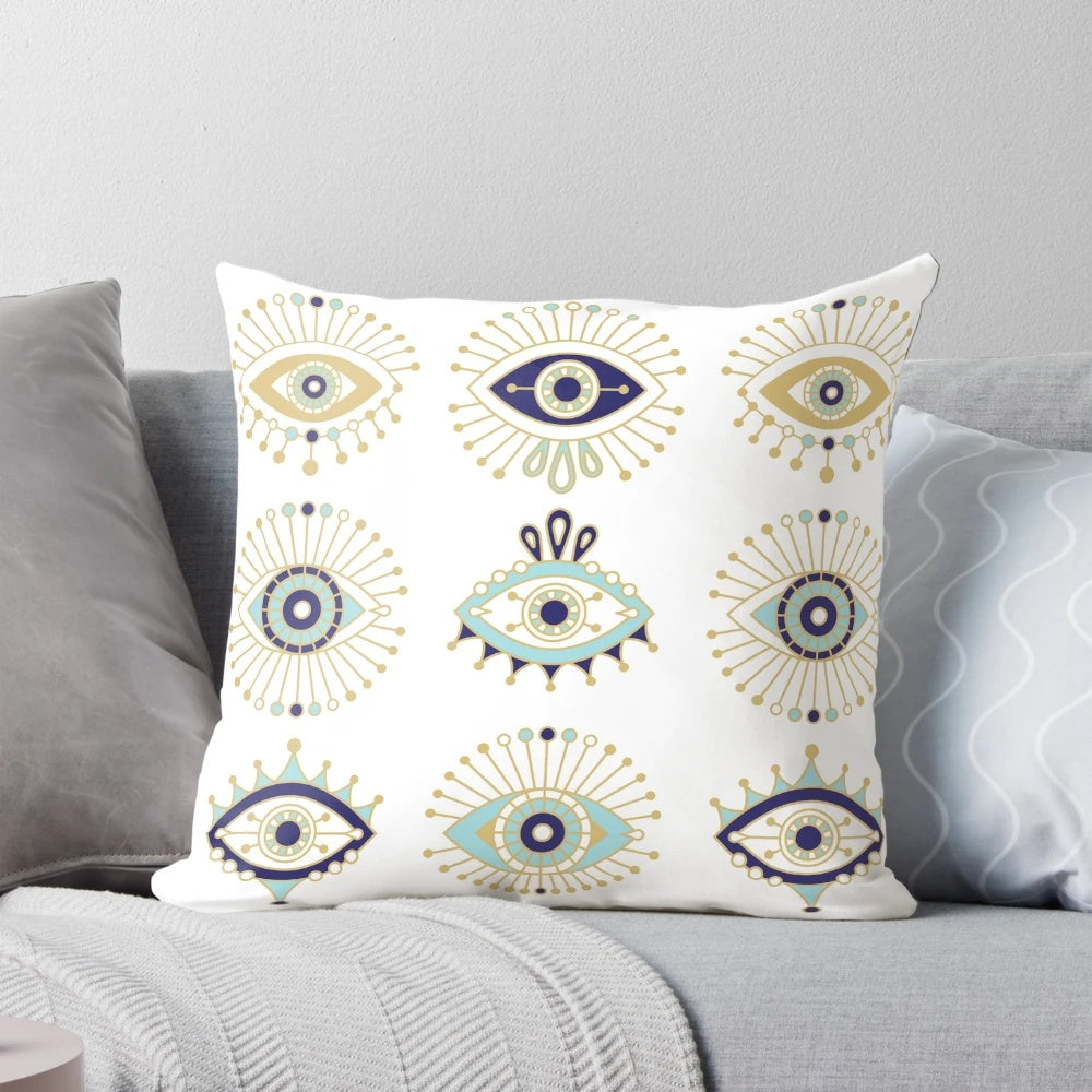 Decorative white pillow featuring a vibrant blue evil eye design