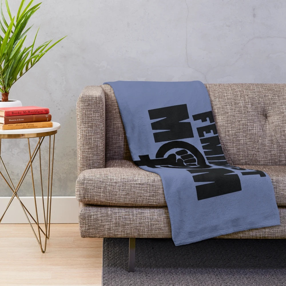 Soft and cozy plush blanket featuring a feminist mom design