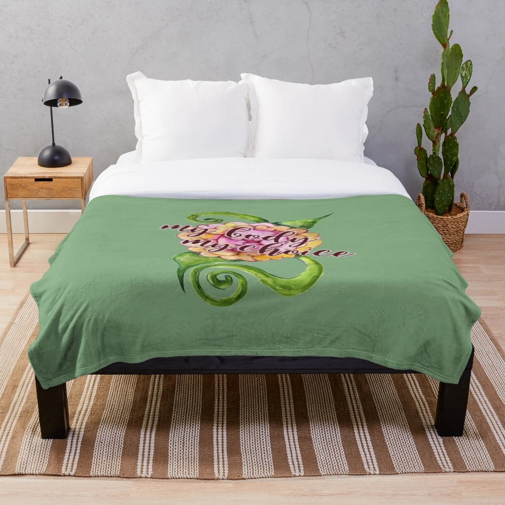 Floral feminist plush blanket with the message "My body, my choice