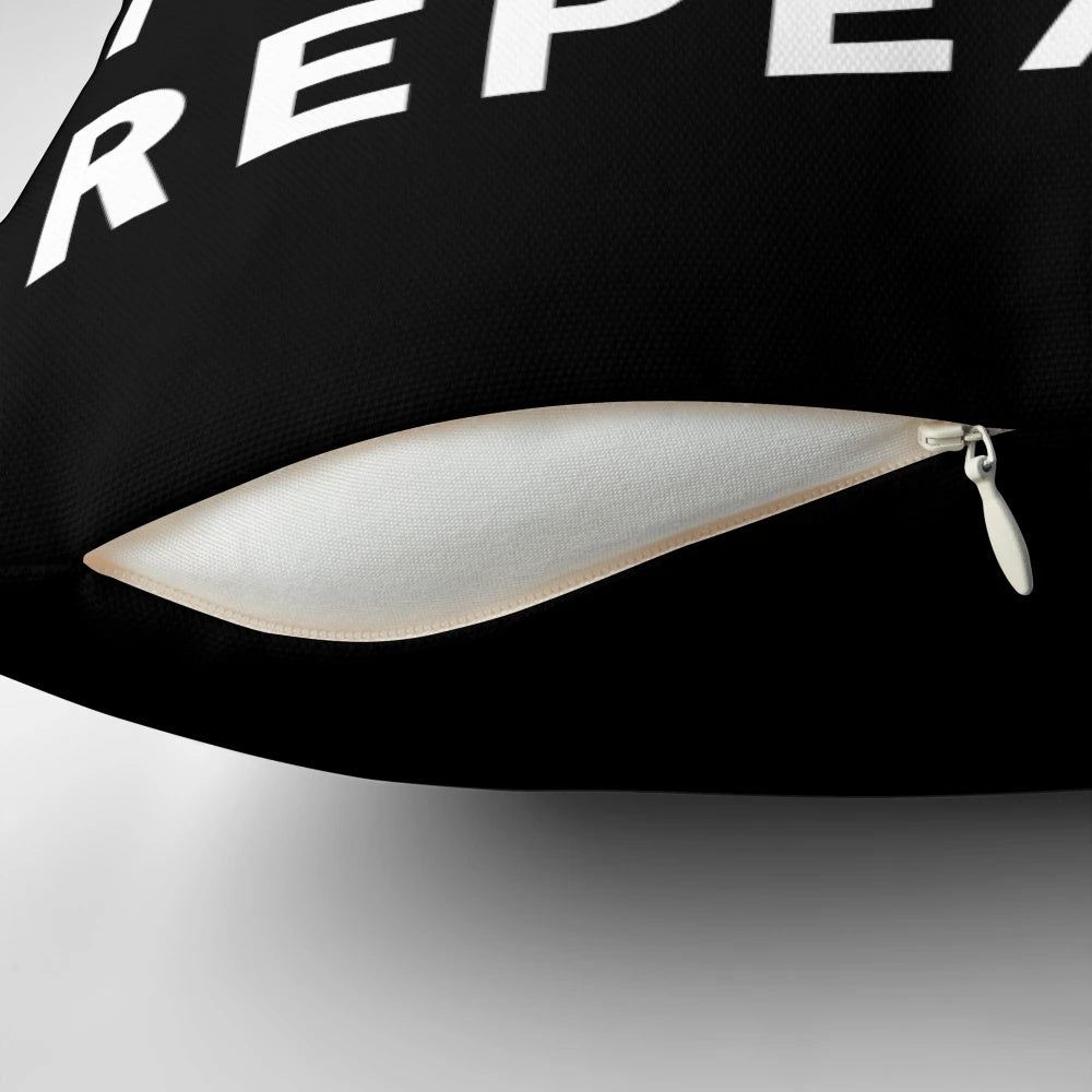 A white pillow with the text "Eat Sleep Football Repeat" in a bold, modern font