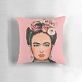 Pink floral throw pillow featuring a portrait of Frida Kahlo