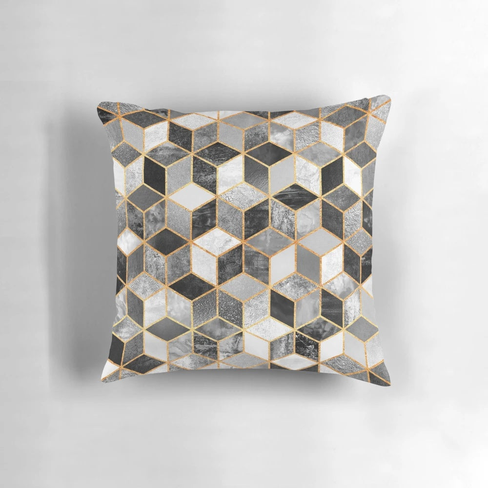 A modern black and white geometric cube patterned throw pillow