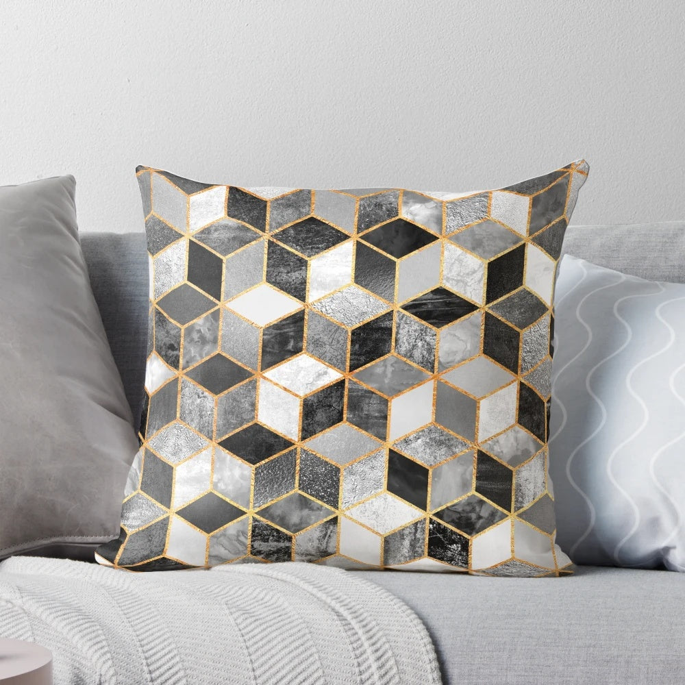 A modern black and white geometric cube patterned throw pillow