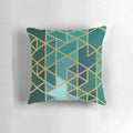 Geometric pattern pillow in gold, green, and blue colors with a modern, abstract design