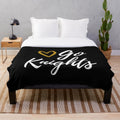 Go Knights plush blanket featuring the UCF logo and colors