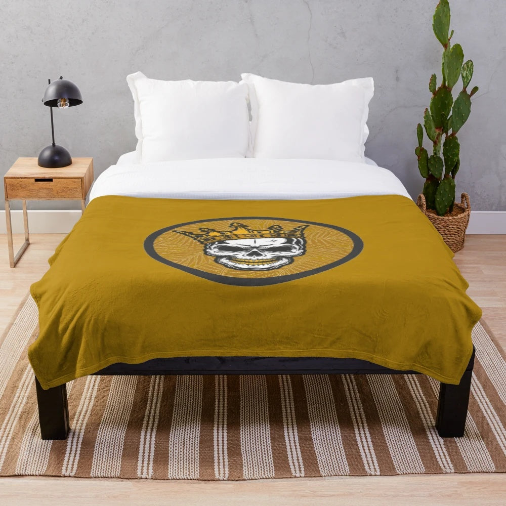Cozy gold skull plush blanket featuring a striking and unique design