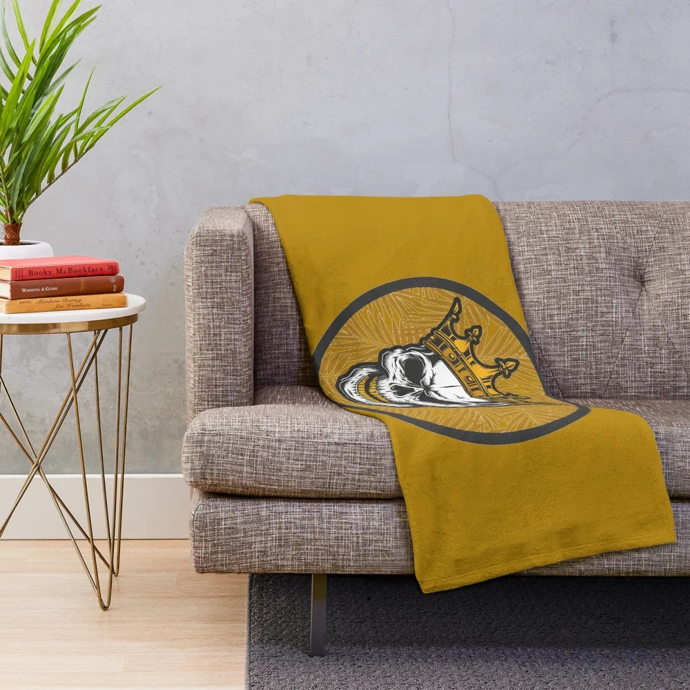 Cozy gold skull plush blanket featuring a striking and unique design