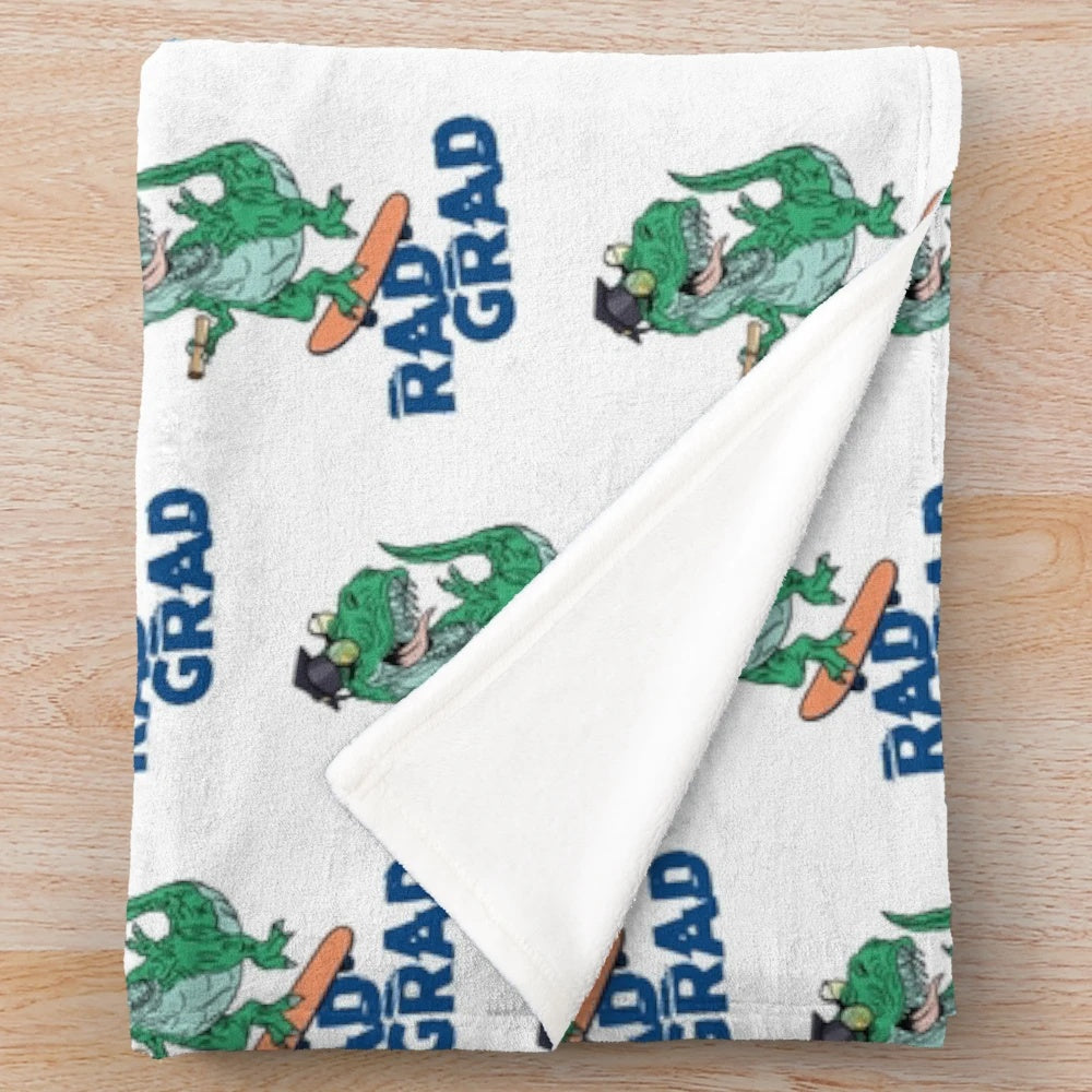Stylish graduation plush blanket featuring dinosaur and skateboard designs