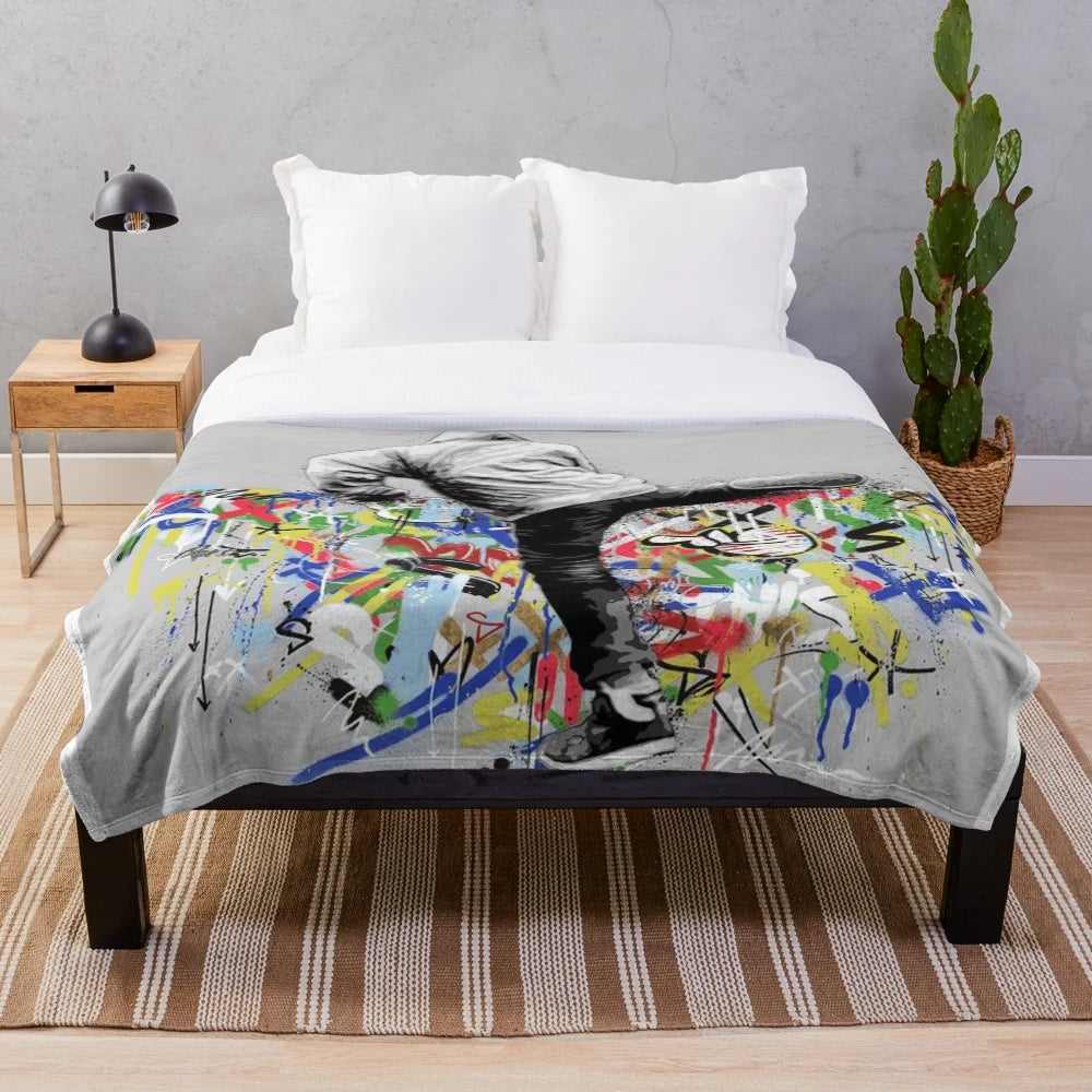 Pop culture inspired plush blanket featuring graffiti art design