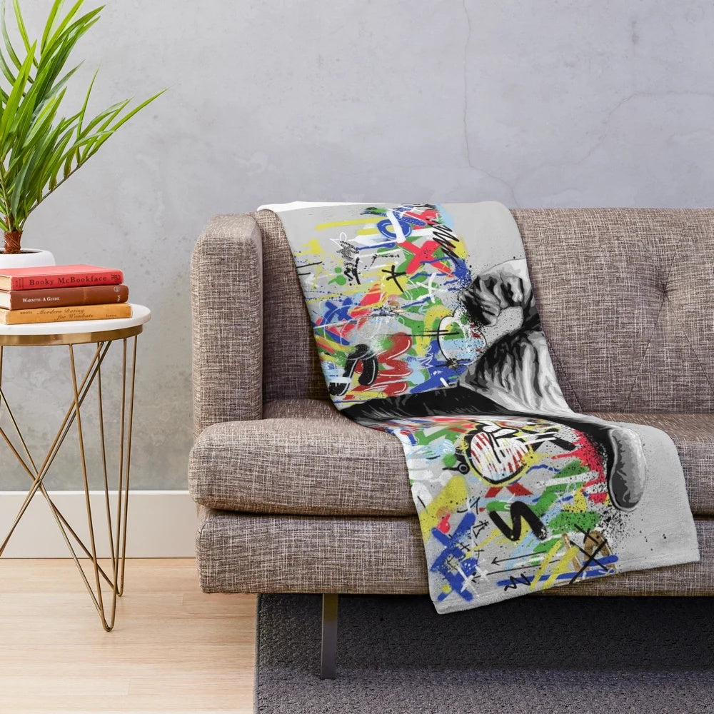 Pop culture inspired plush blanket featuring graffiti art design