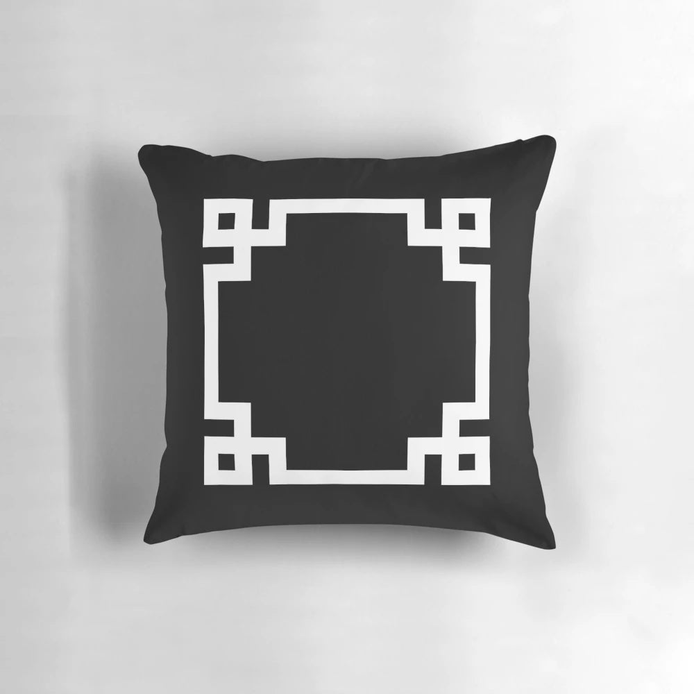 Black and white square pillow with a classic Greek key design, perfect for adding a touch of modern elegance to any room.