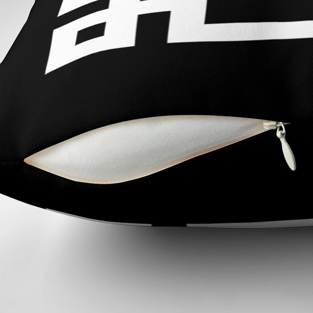 Black and white square pillow with a classic Greek key design, perfect for adding a touch of modern elegance to any room.