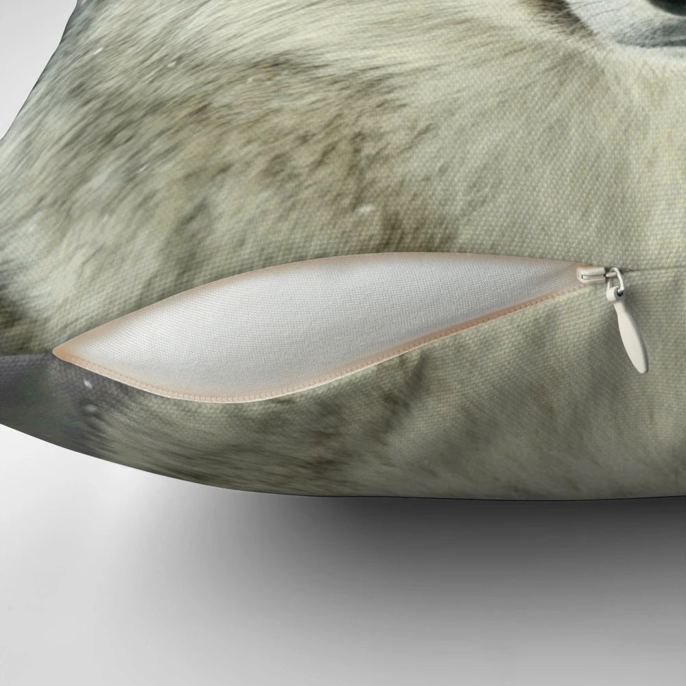 A grey wolf-inspired decorative throw pillow featuring a wilderness design