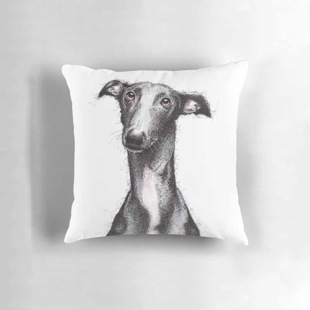 Beautiful black greyhound looking soulful on a decorative throw pillow