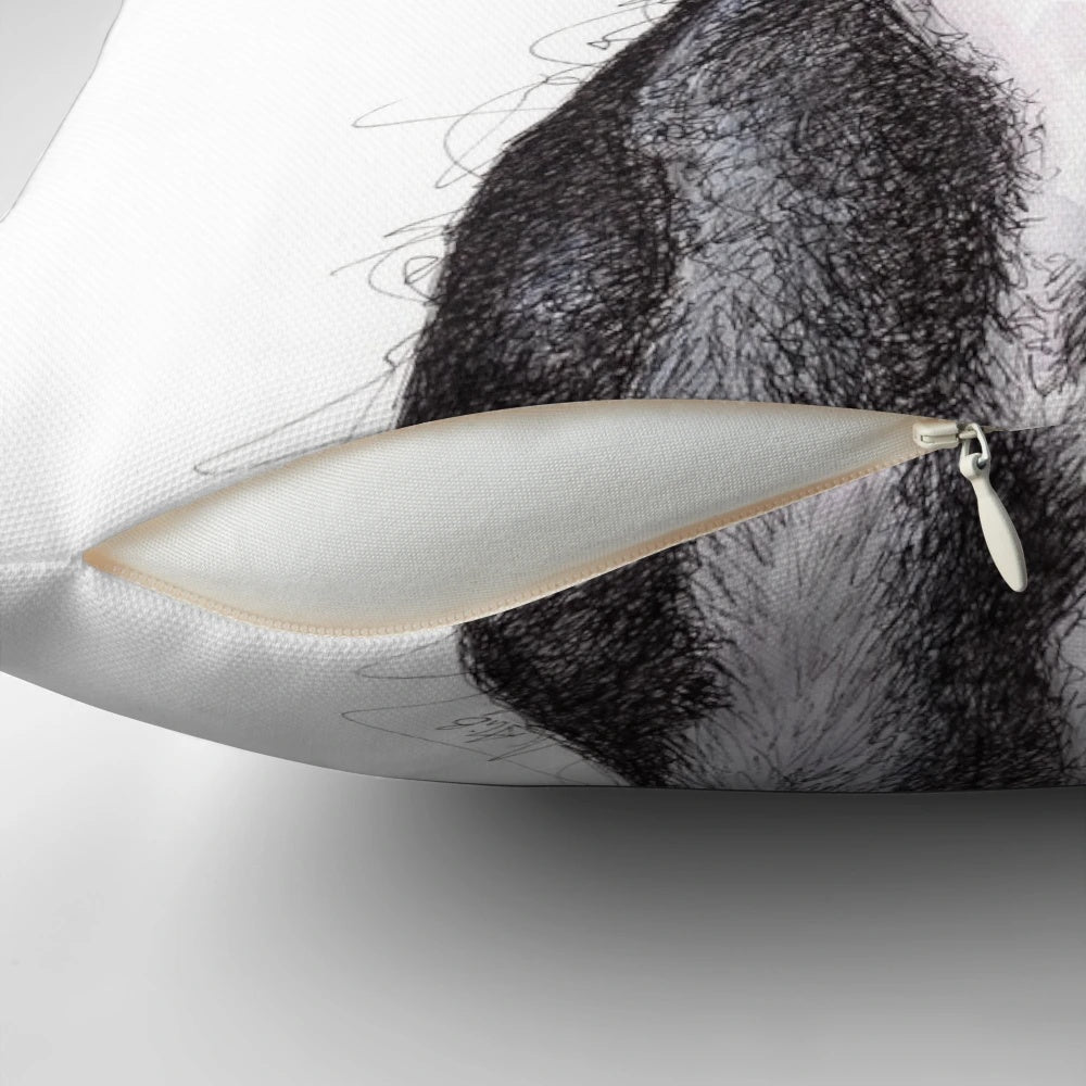 Beautiful black greyhound looking soulful on a decorative throw pillow