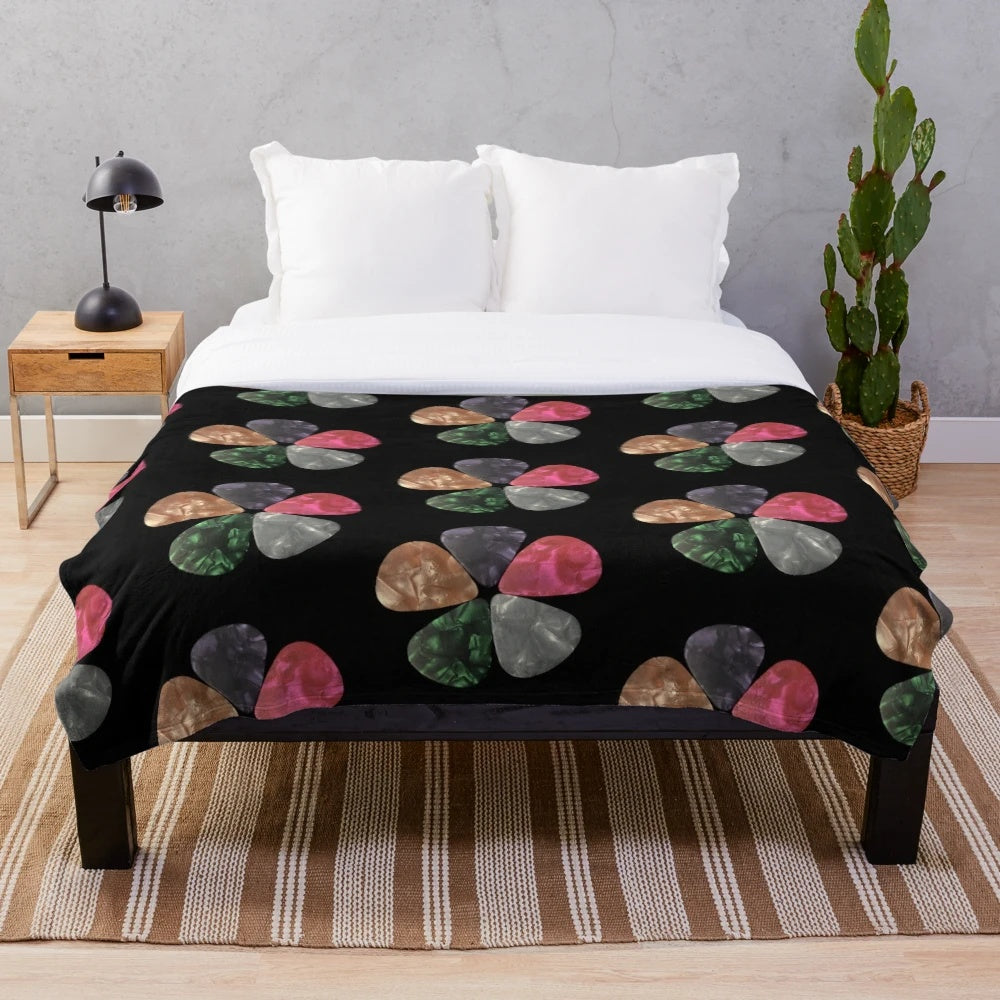 Cozy plush blanket with guitar picks pattern