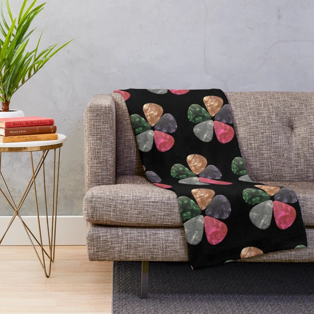 Cozy plush blanket with guitar picks pattern