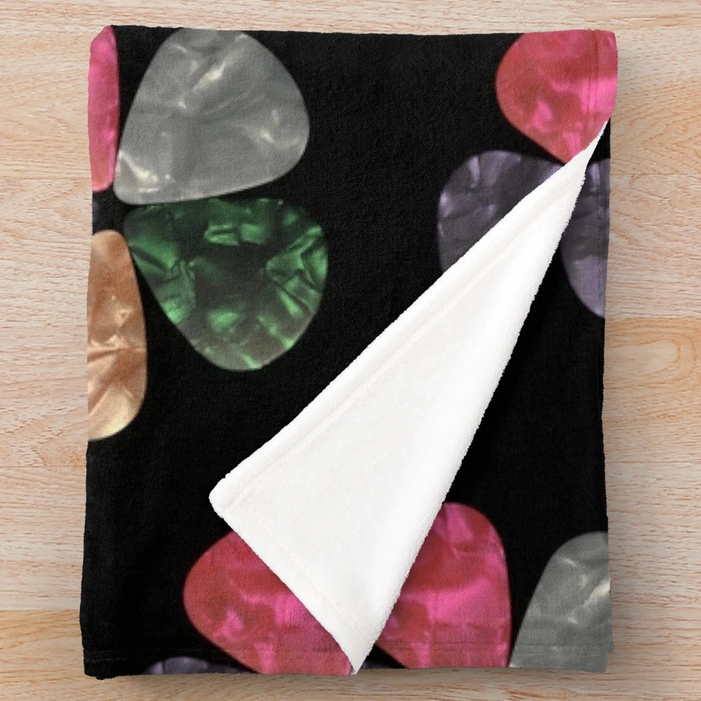 Cozy plush blanket with guitar picks pattern
