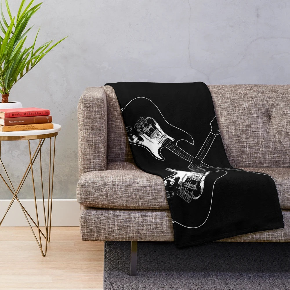 Plush blanket featuring a crossed guitar silhouette design