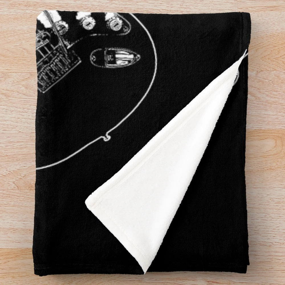 Plush blanket featuring a crossed guitar silhouette design