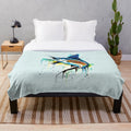 Guy Harvey inspired plush blanket with racing and music motifs