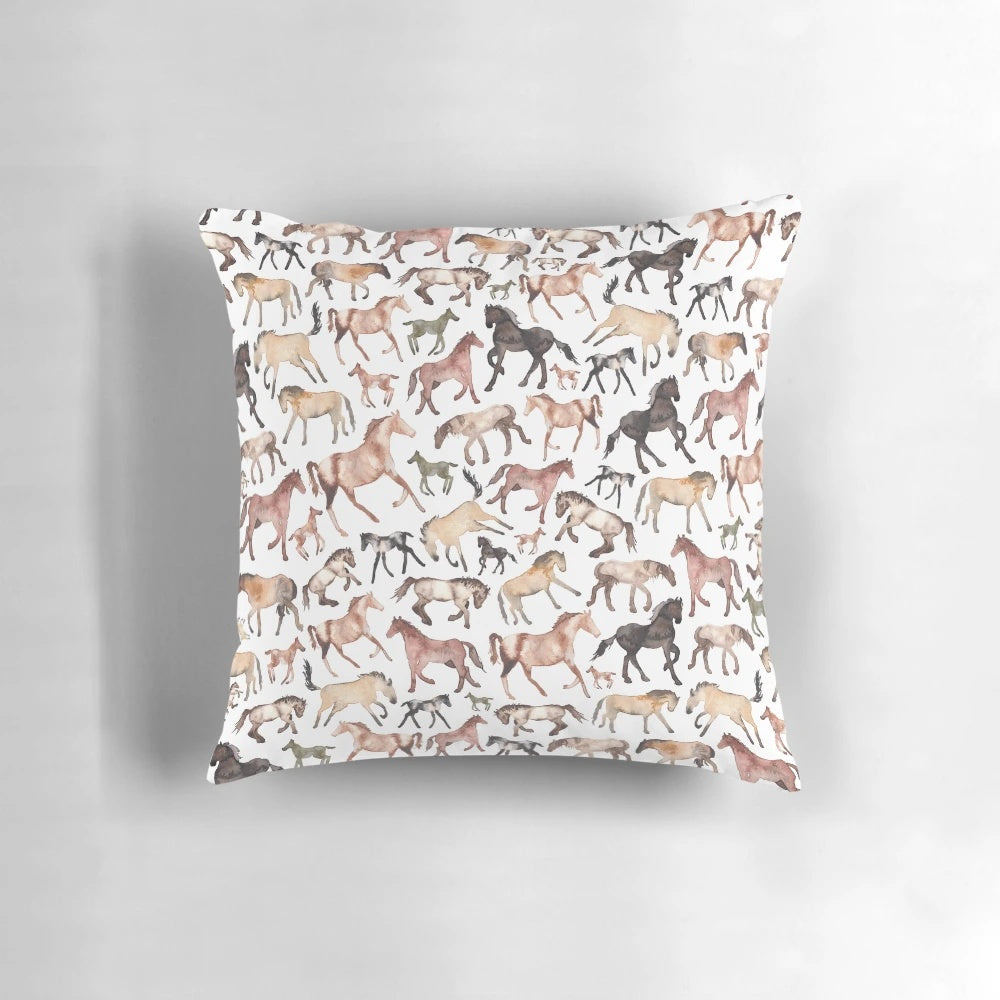 A watercolor-inspired throw pillow featuring a beautiful image of a horse against a patterned background.