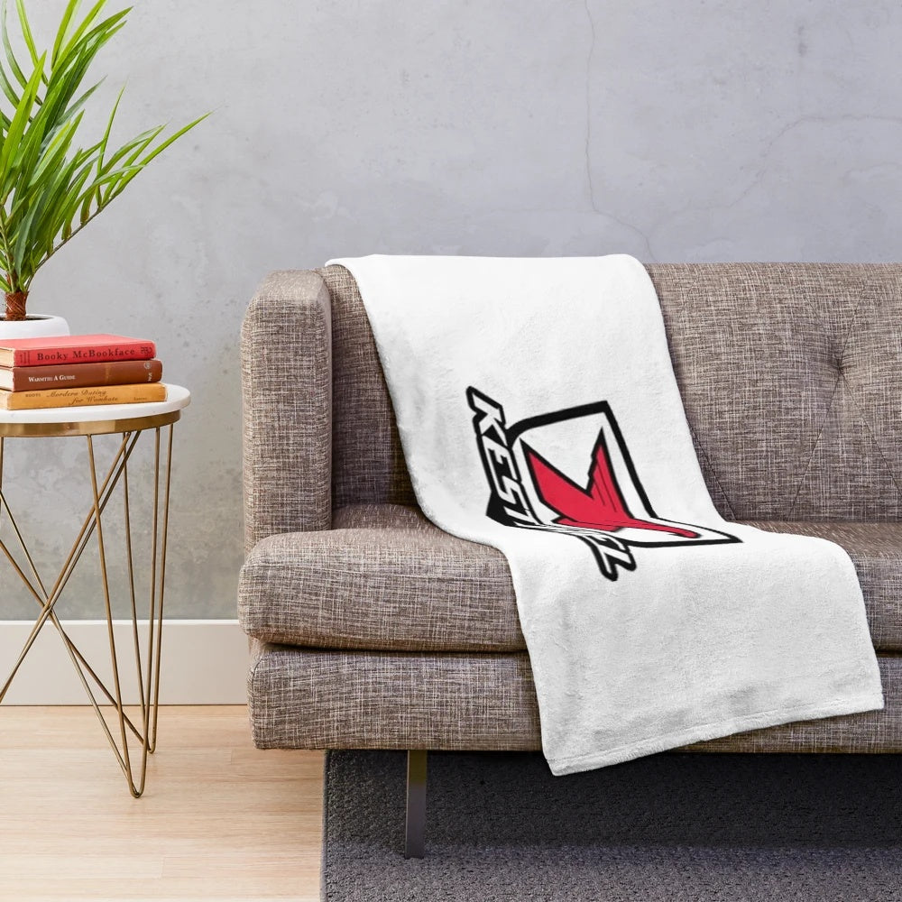 Kestrel-inspired plush blanket with cycling logo design