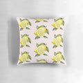 A decorative pillow featuring a vibrant lemon design with green leaves on a yellow background.