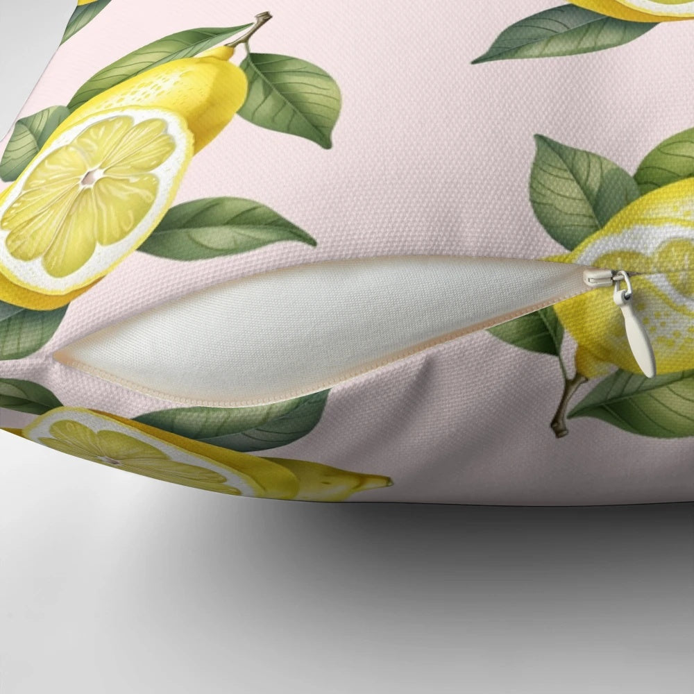 A decorative pillow featuring a vibrant lemon design with green leaves on a yellow background.