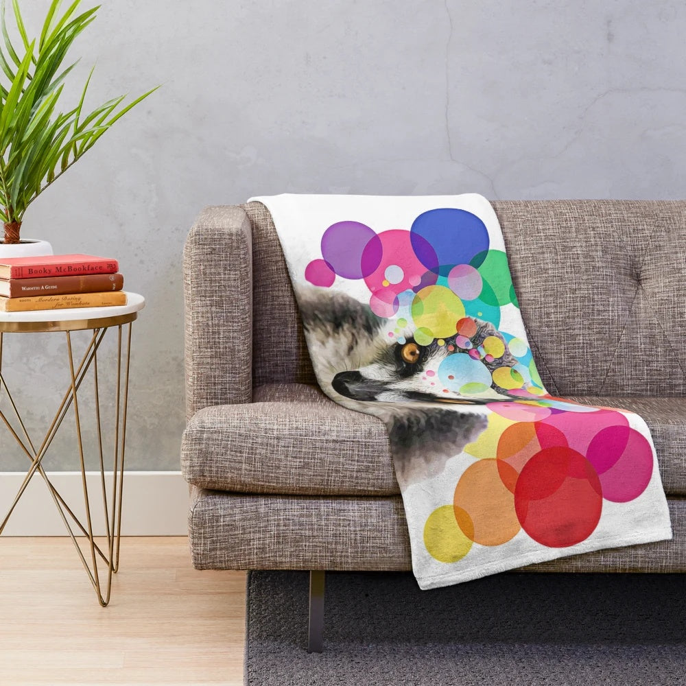 Colorful pop art depiction of a lemur on a plush blanket