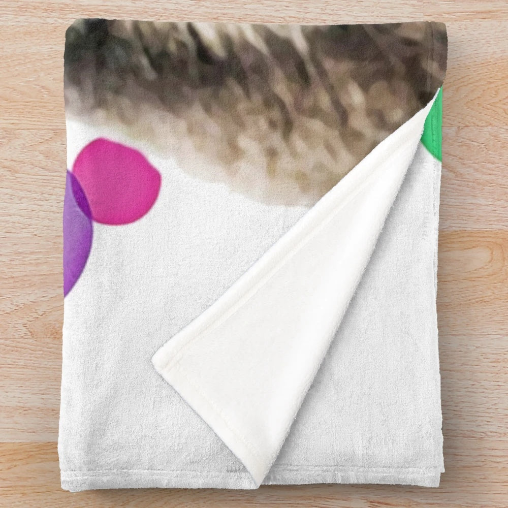 Colorful pop art depiction of a lemur on a plush blanket
