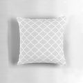 A light grey quatrefoil lattice pattern throw pillow with a modern, geometric design.