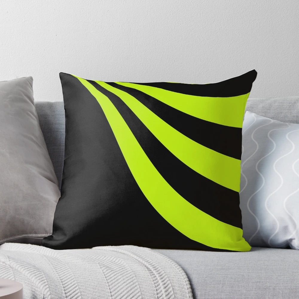 Lime green pillow with a wave design on a black background