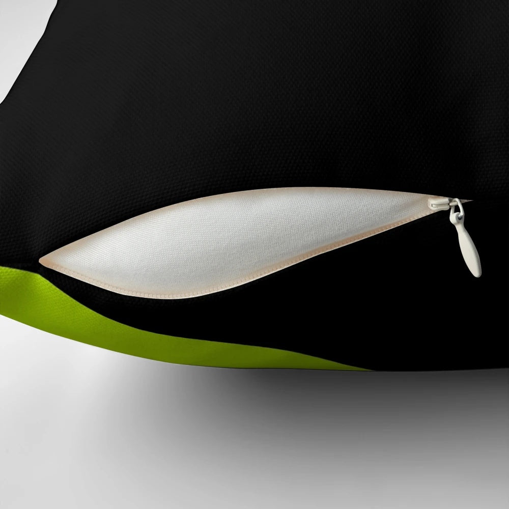 Lime green pillow with a wave design on a black background