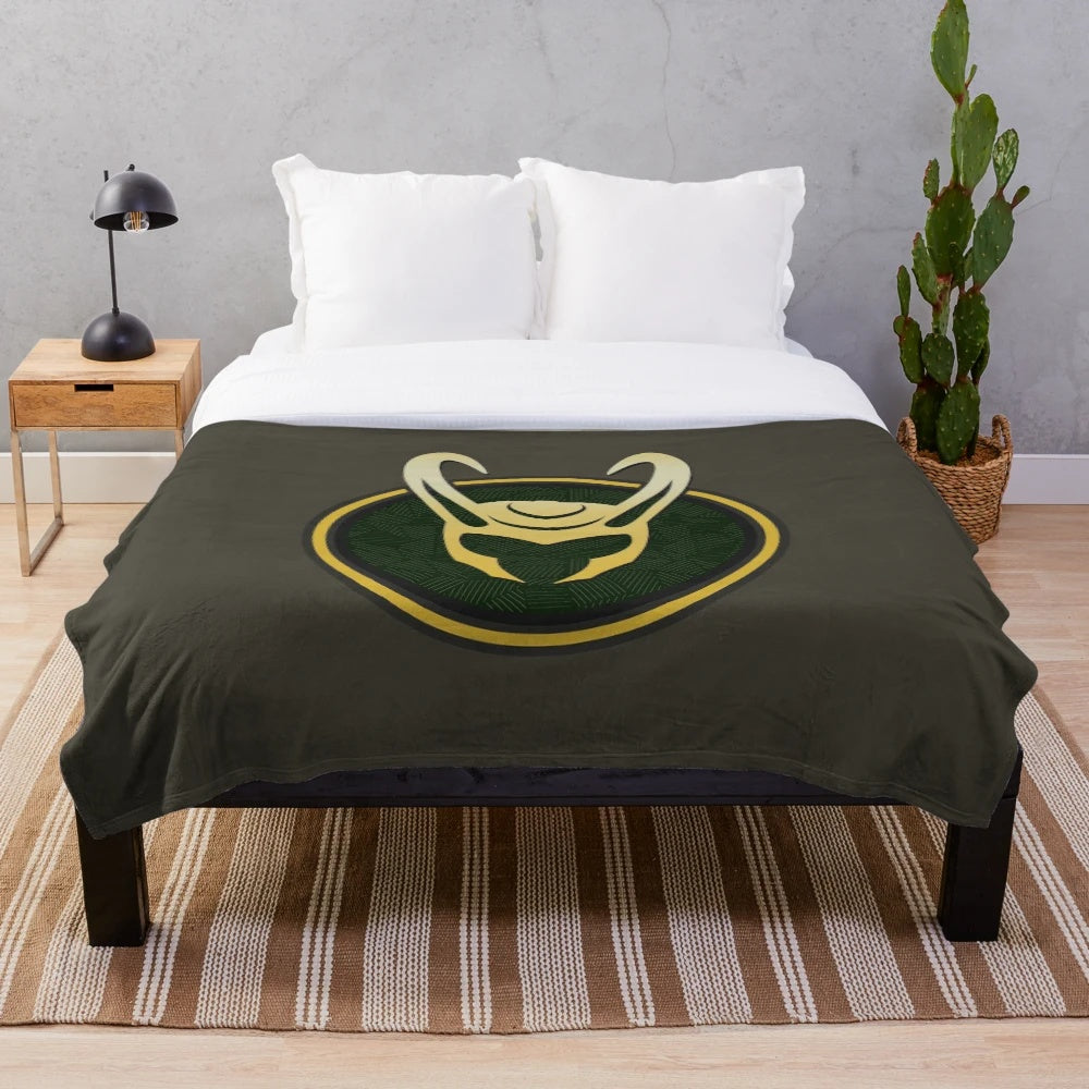 Loki-inspired plush blanket featuring the god of mischief's iconic helmet