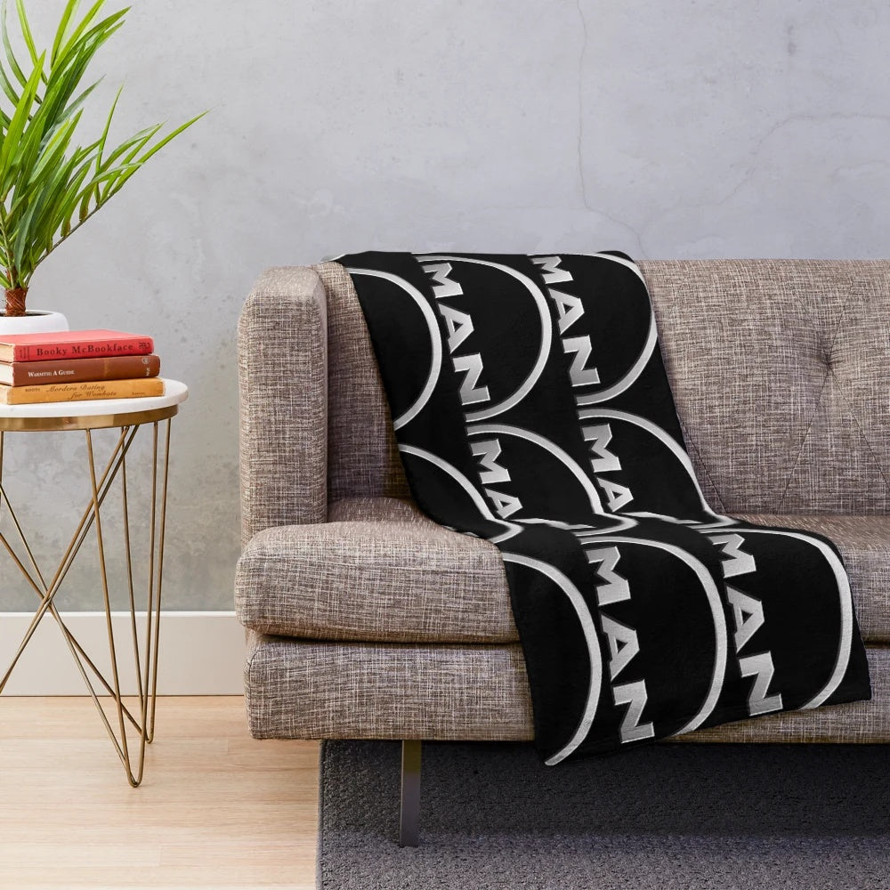 Man logo plush blanket with truck design