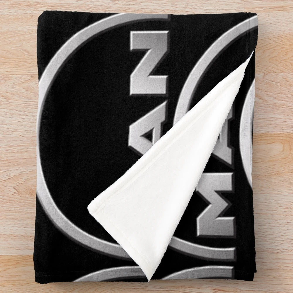 Man logo plush blanket with truck design