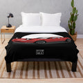 Red plush blanket featuring the iconic Mazda Miata MX-5 design