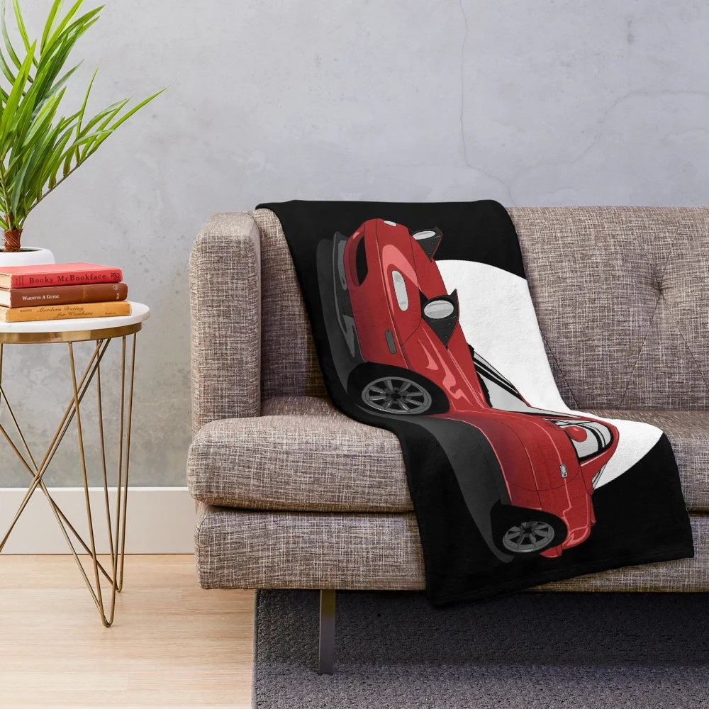Red plush blanket featuring the iconic Mazda Miata MX-5 design