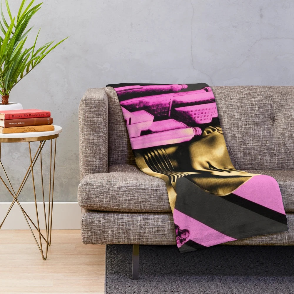 Plush blanket featuring a futuristic Metropolis city scene in pink, black, gold, and beige