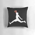 White decorative pillow featuring the iconic Michael Jordan dunk logo