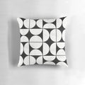 Mid-century modern black and white concrete pillow with a unique pattern of circles and half-circles