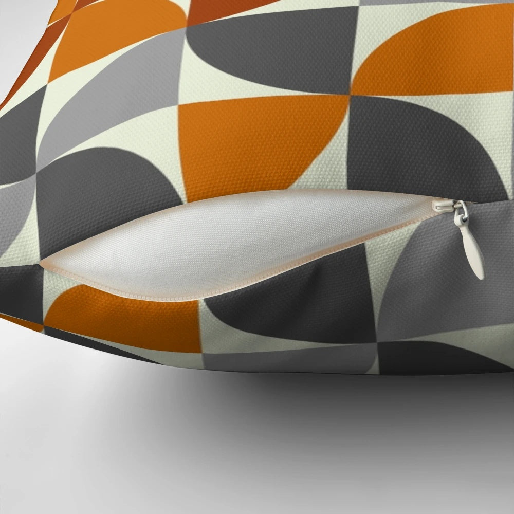 Mid century modern style throw pillow with a geometric pattern in grey and orange colors