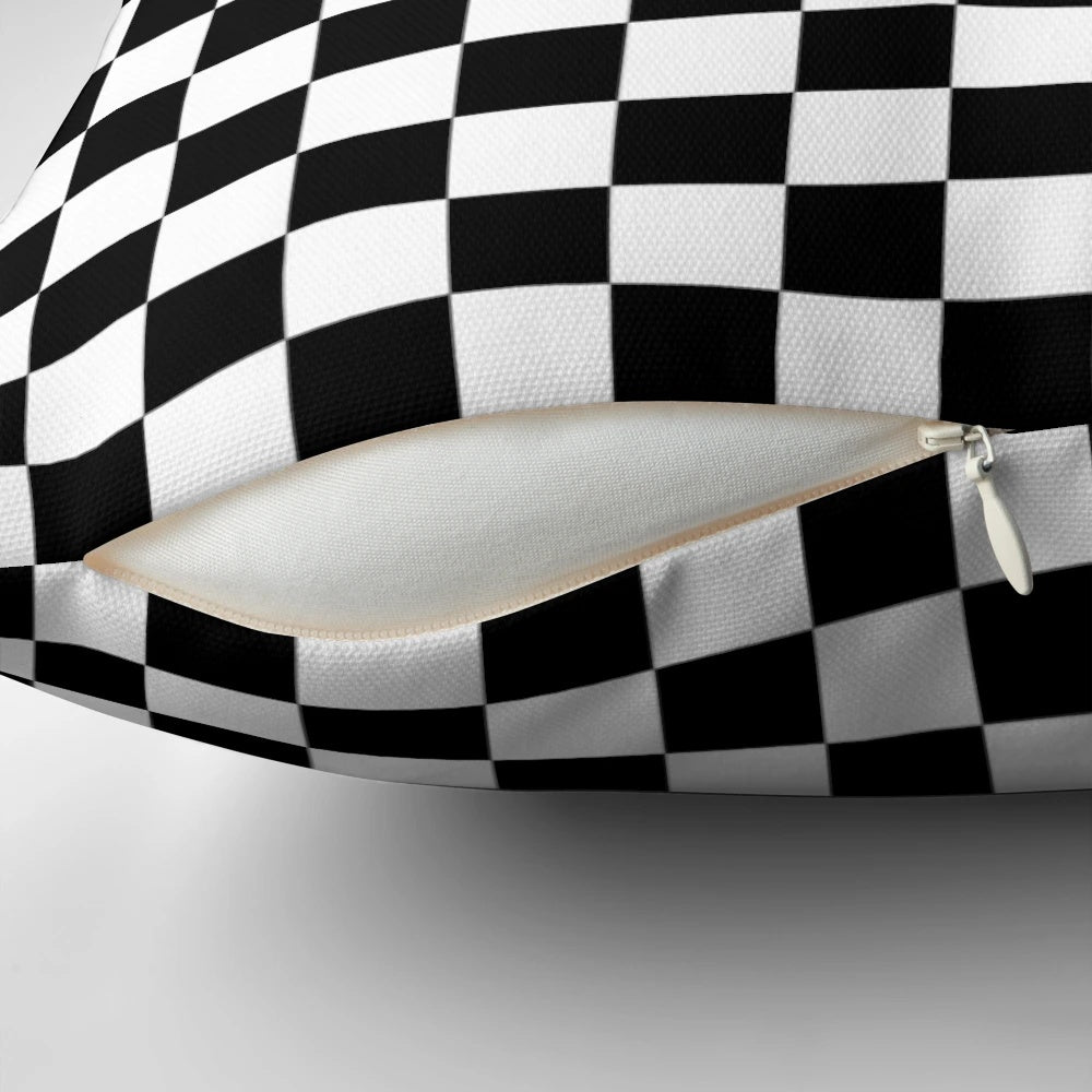 Black and white checkered pattern pillow with a classic checkerboard design