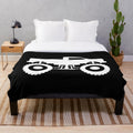 Monster truck silhouette design on a plush, cozy blanket
