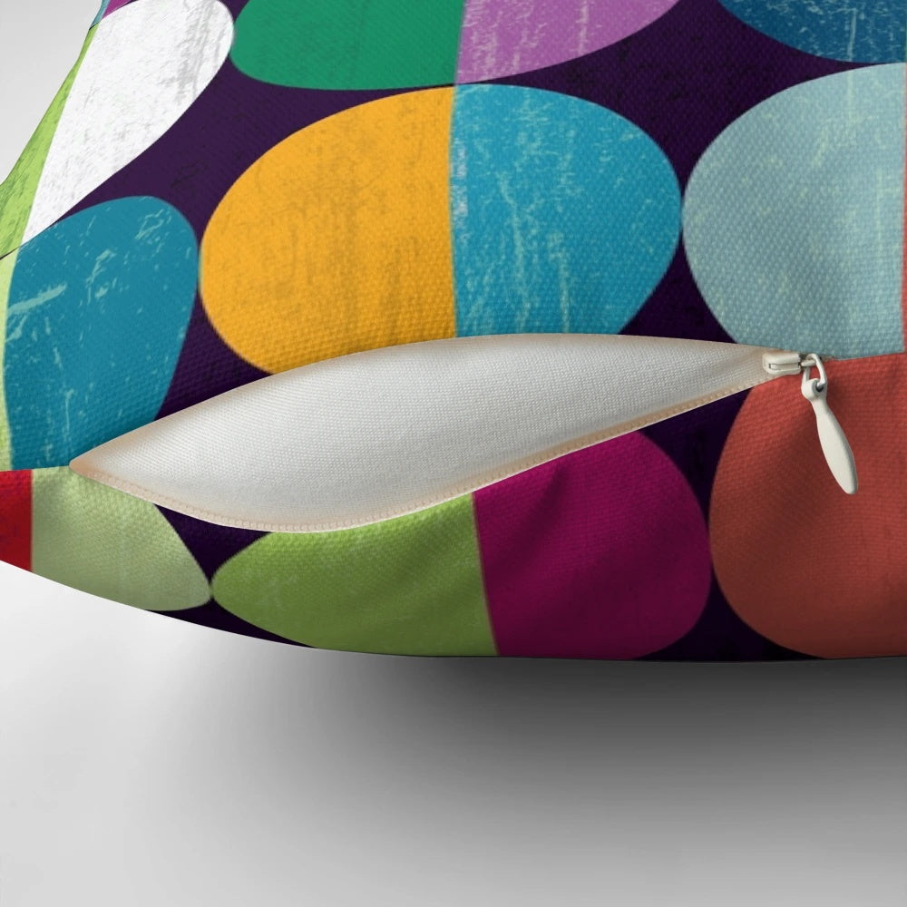 Soft, circular moon-themed pillow with a modern geometric pattern in shades of yellow, orange, blue, green, pink, and navy.