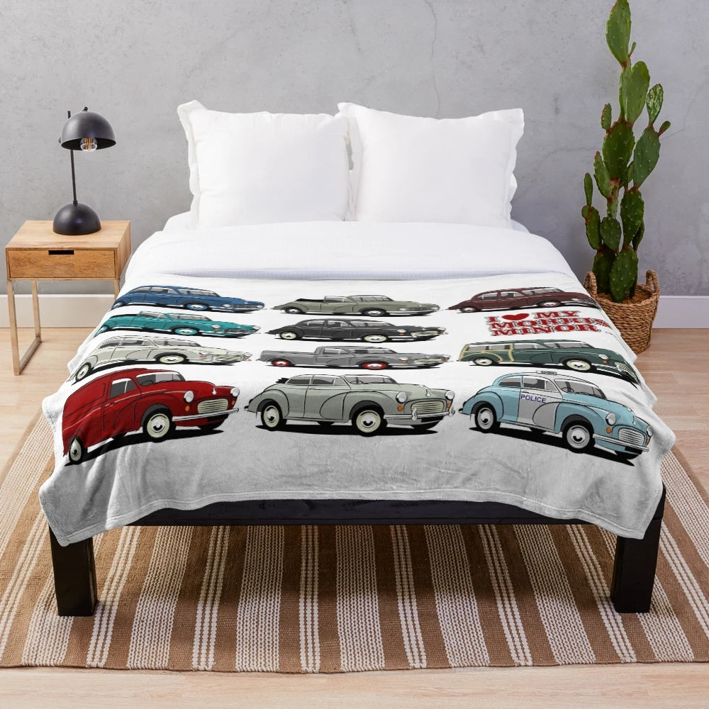 Morris Minor inspired plush blanket featuring a cartoon-style illustration of the iconic classic British car