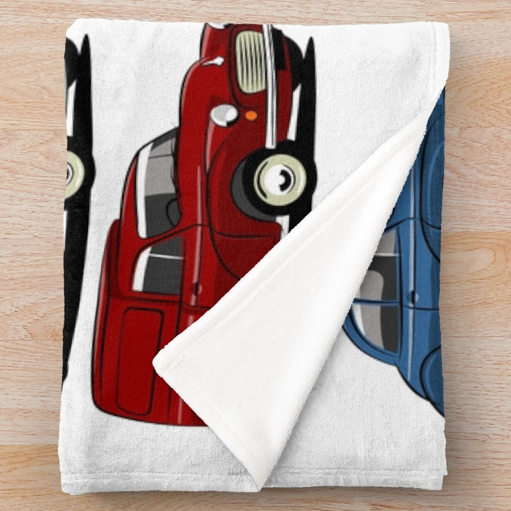Morris Minor inspired plush blanket featuring a cartoon-style illustration of the iconic classic British car