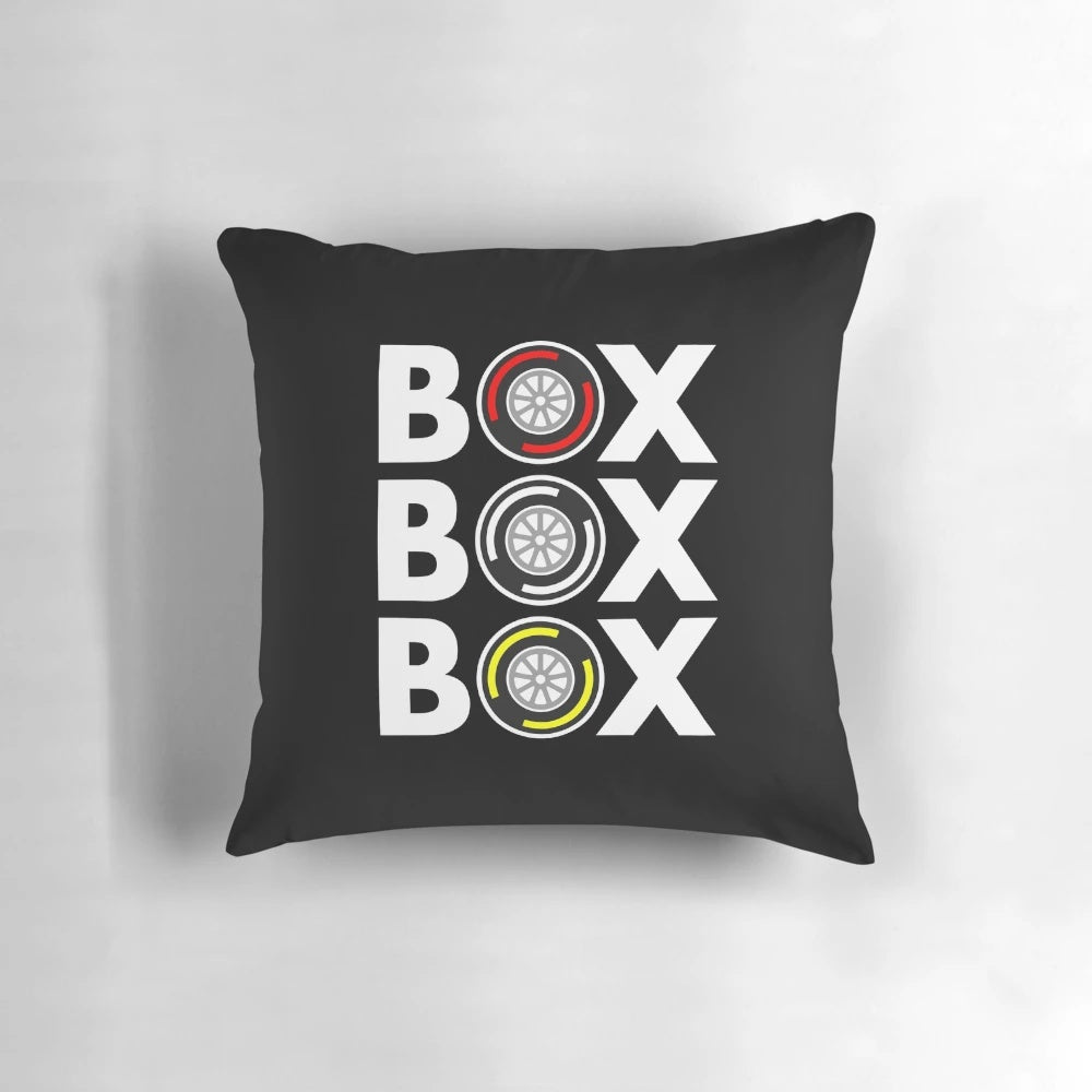 A white pillow with a bold, monochrome design inspired by formula 1 tires and race car culture.