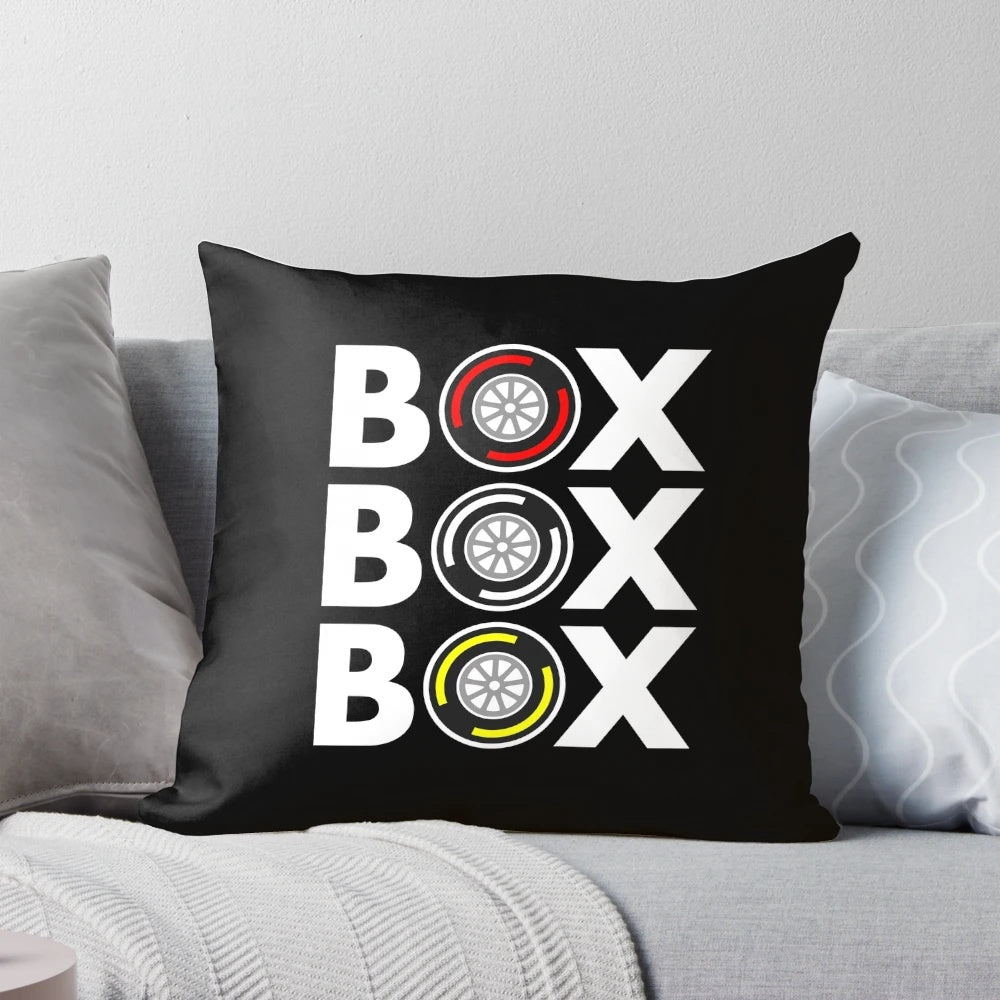A white pillow with a bold, monochrome design inspired by formula 1 tires and race car culture.